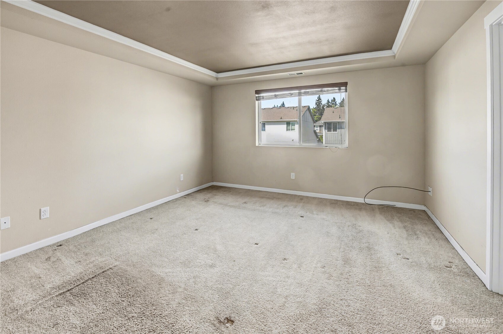 Primary bedroom located on upper level with double-door entry from hallway.