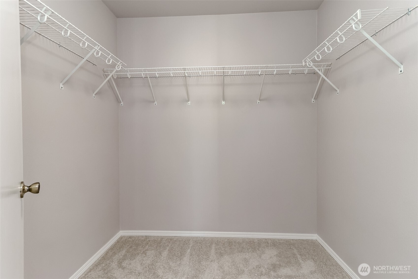 Primary bedroom walk in closet