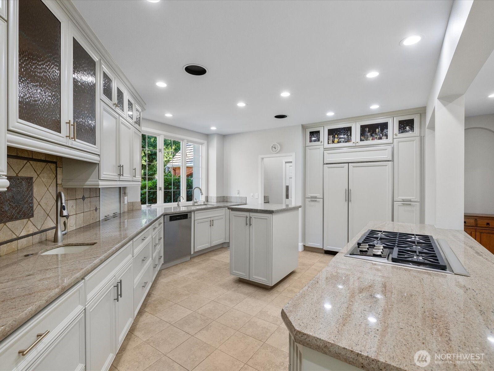 Chef's Dream Kitchen.  Butler's pantry to the left of fridge.  Wolf stove top.  Sub zero fridge.  Freshly painted.