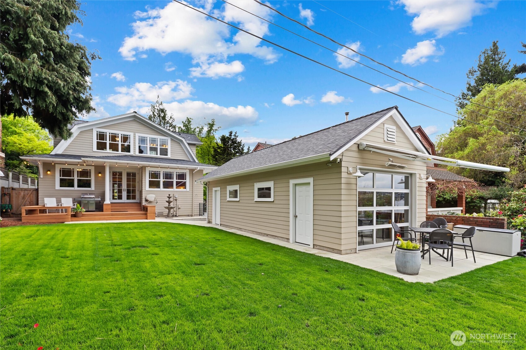 Level, grassy backyard creates a truly special setting for gatherings, boating views, yard games, and year-round enjoyment of the canal and city skyline
