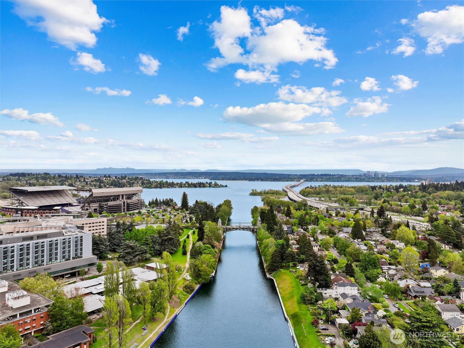 This is Seattle waterfront living at its finest—timeless architecture, modern updates, and a front-row seat to Montlake Cut