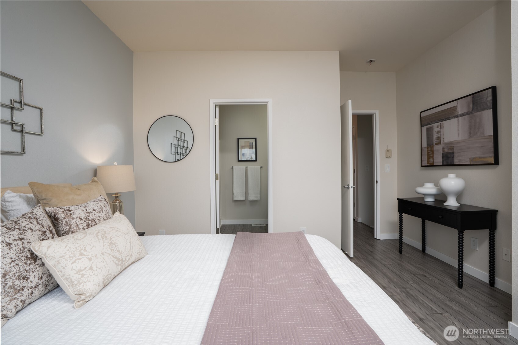 The primary bedroom features an en-suite primary bathroom, creating a private and comfortable retreat for everyday living.