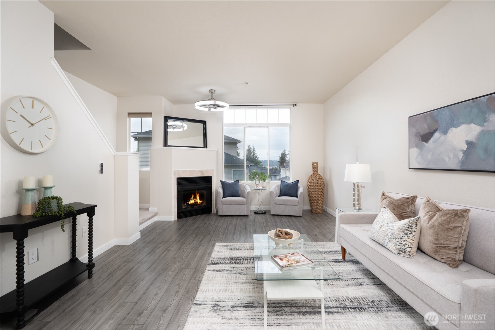 The living area is lined with oversized window that floods the space with natural light, creating a bright and welcoming atmosphere throughout the day.