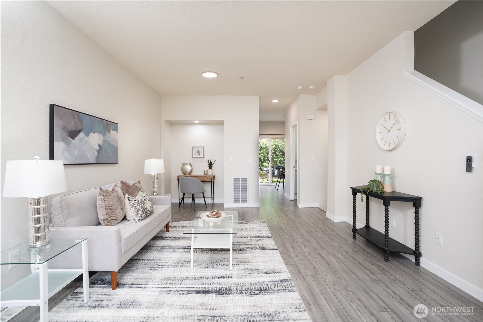 The living room includes a cozy nook perfect for a desk, along with a conveniently placed coat closet just off the kitchen.