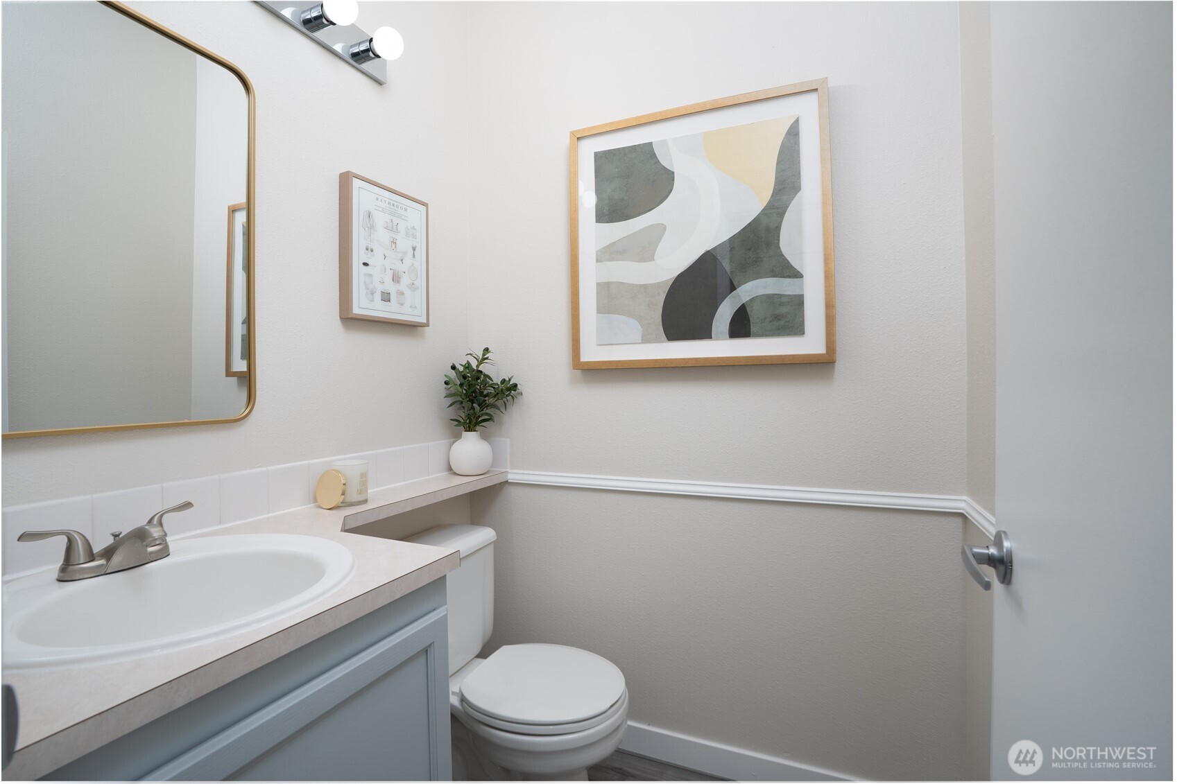 A conveniently located half bath on the main floor ensures guests don’t need to head upstairs.
