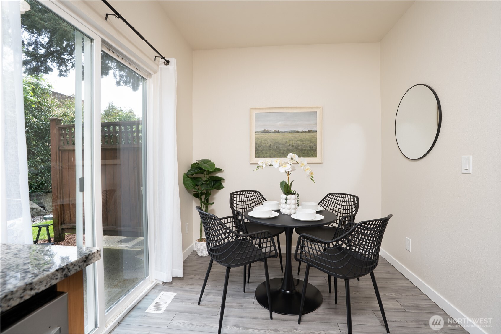 The dining area features a sliding glass door that opens to the patio, creating an easy flow for indoor-outdoor living.