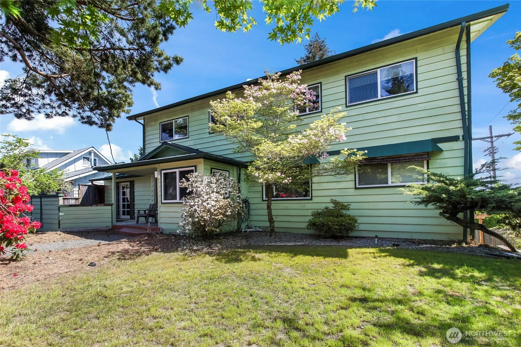Private front yard with mature landscaping