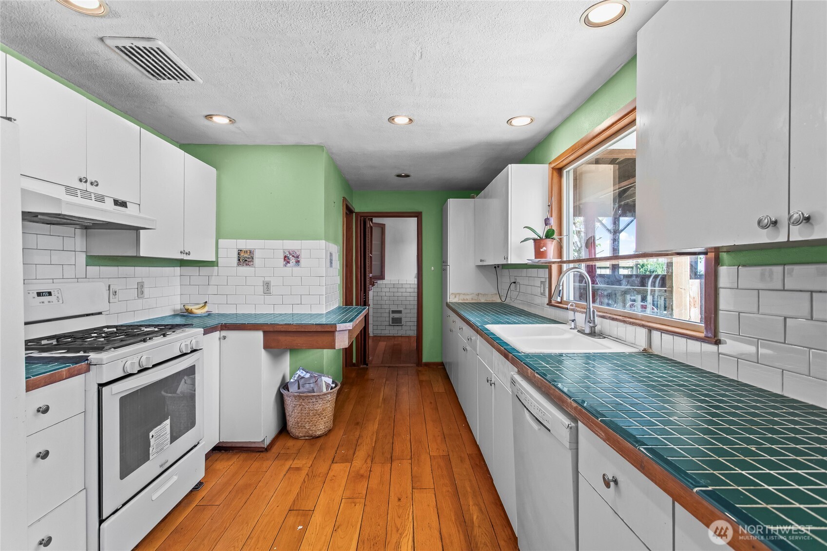 Galley style kitchen with powder room at the end