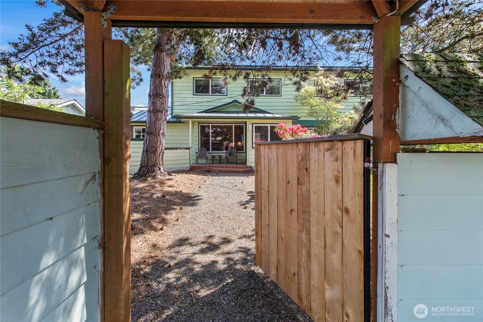 A gate adds to the privacy of this home!