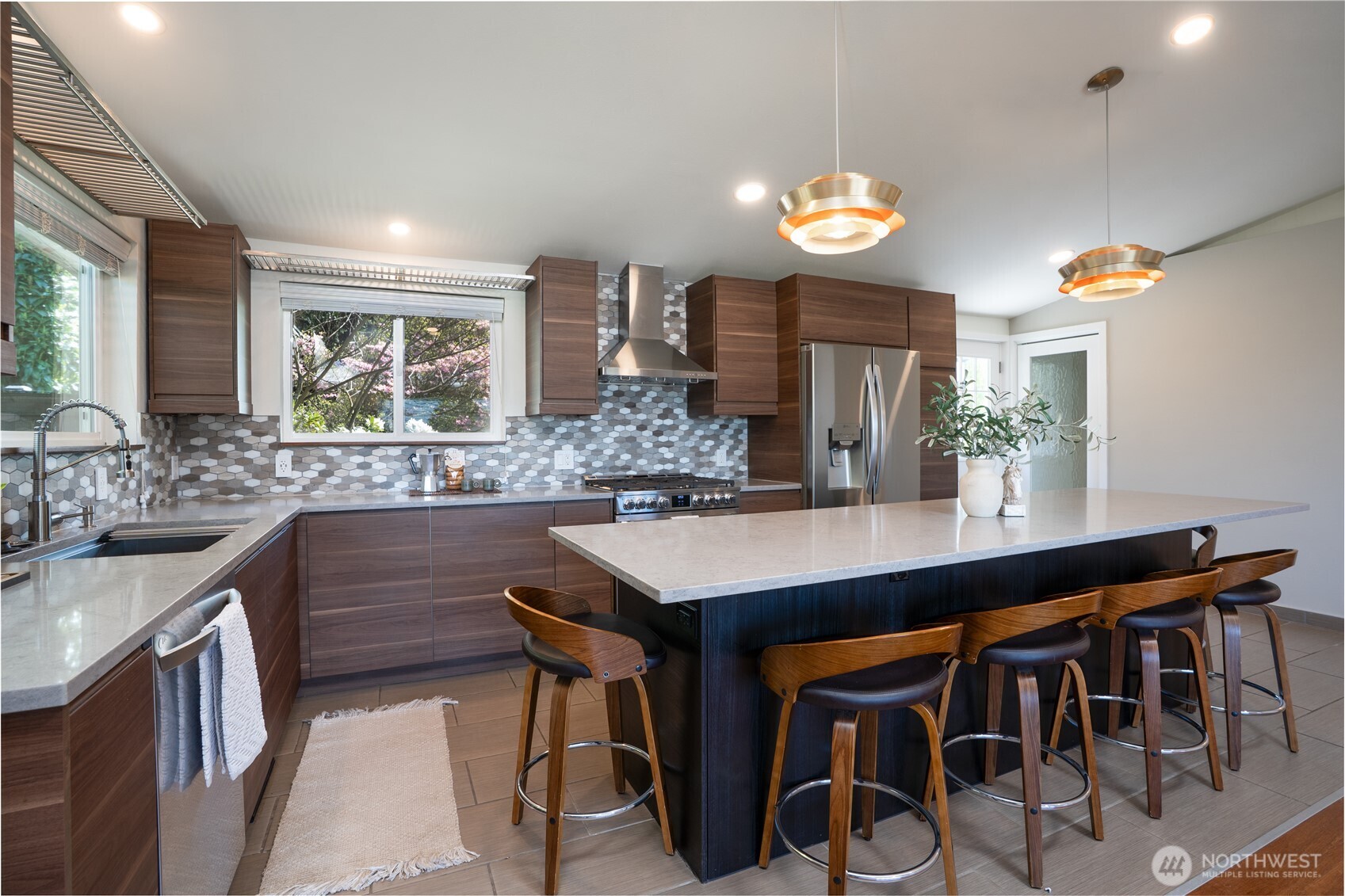 Island Seating for 6, Double Door Fridge & Lower Drawer Freezer...Doors to Back Patio & Fully Finished Lower Living Area...