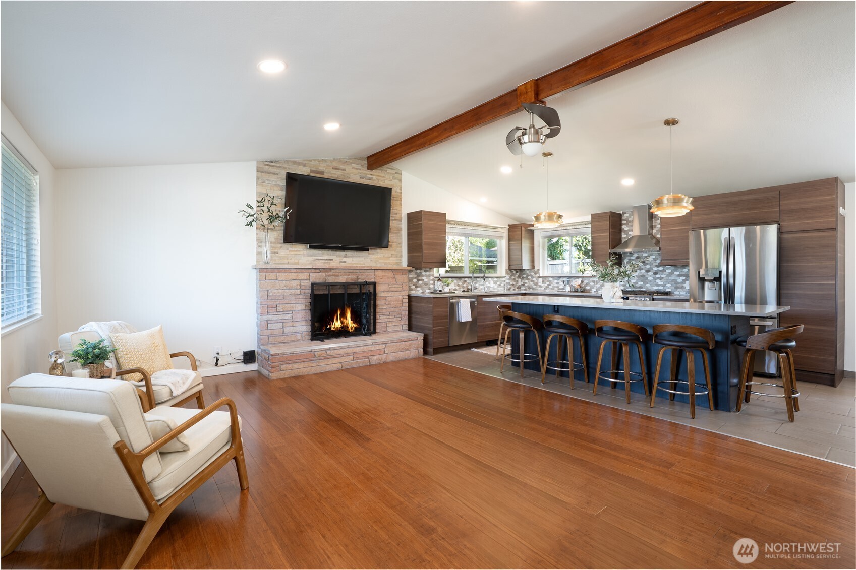 Enter the Blue Door into Great Room with Vaulted Ceilings, Wood Burning FP, Open Kitchen, Bamboo & Tile Floors, Fresh New Paint throughout...