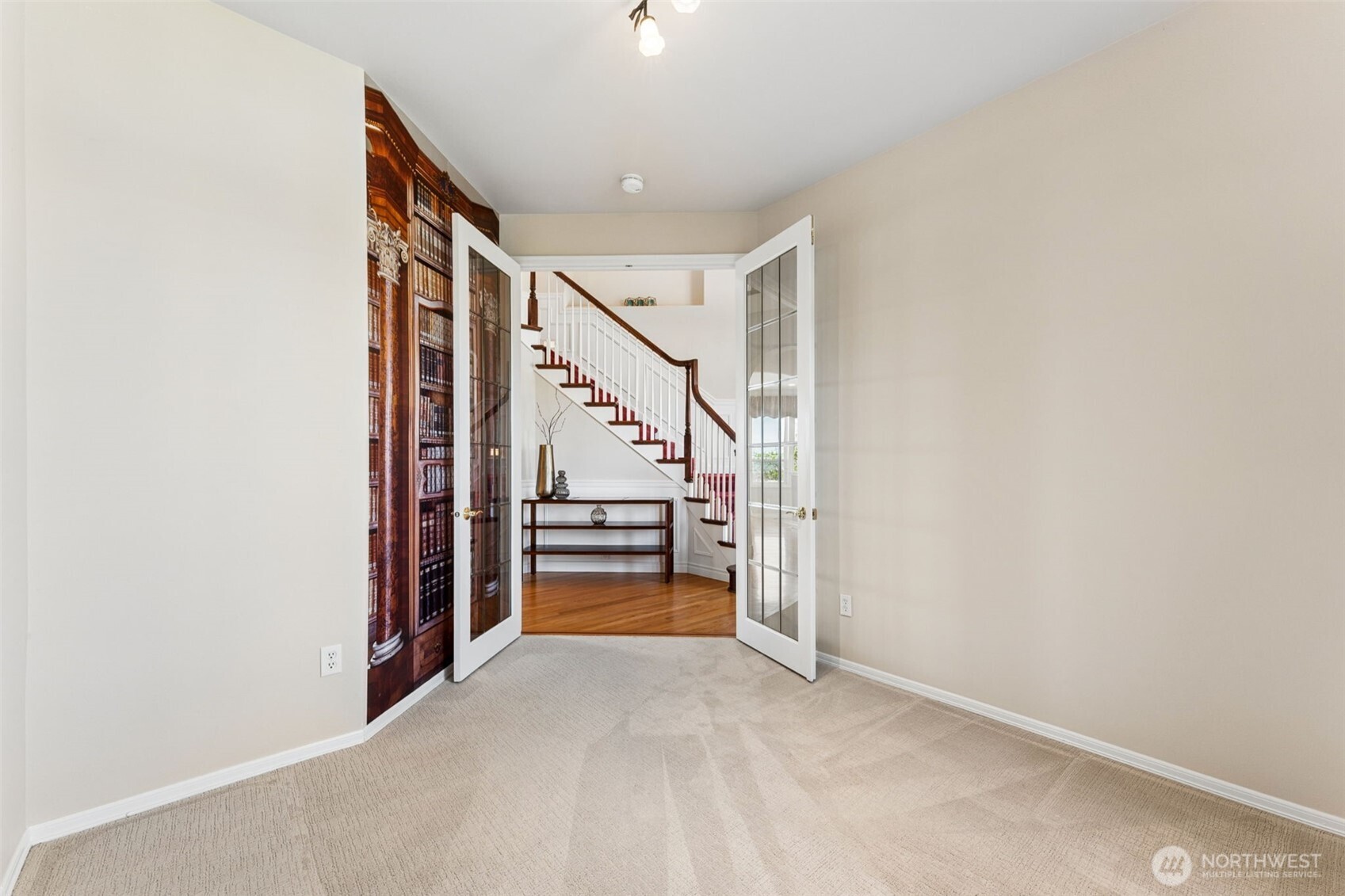 Main floor den with French doors, perfect for an office next to the entry