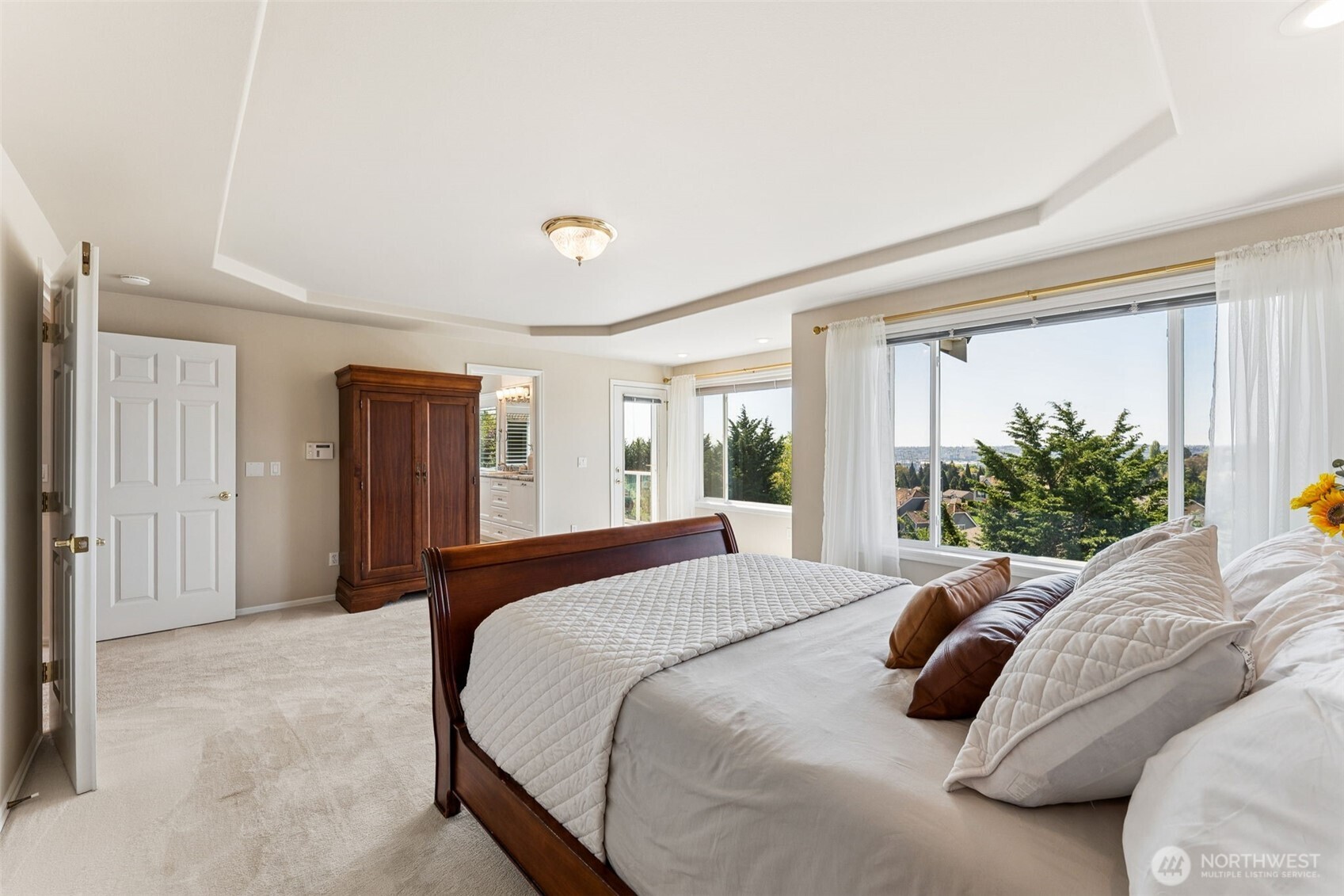 Primary bedroom at the rear of the house to take advantage of the view