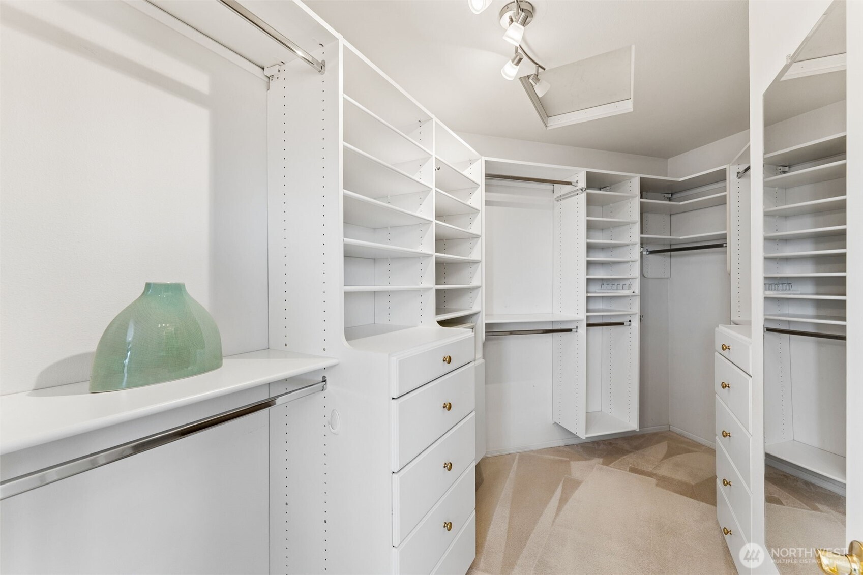 One of 2 walk-in closets in the primary suite