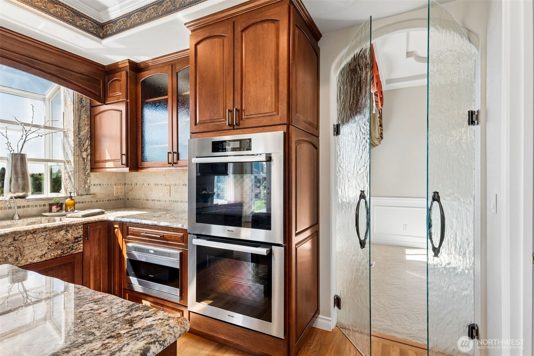 Beautiful glass doors between the kitchen and dining room