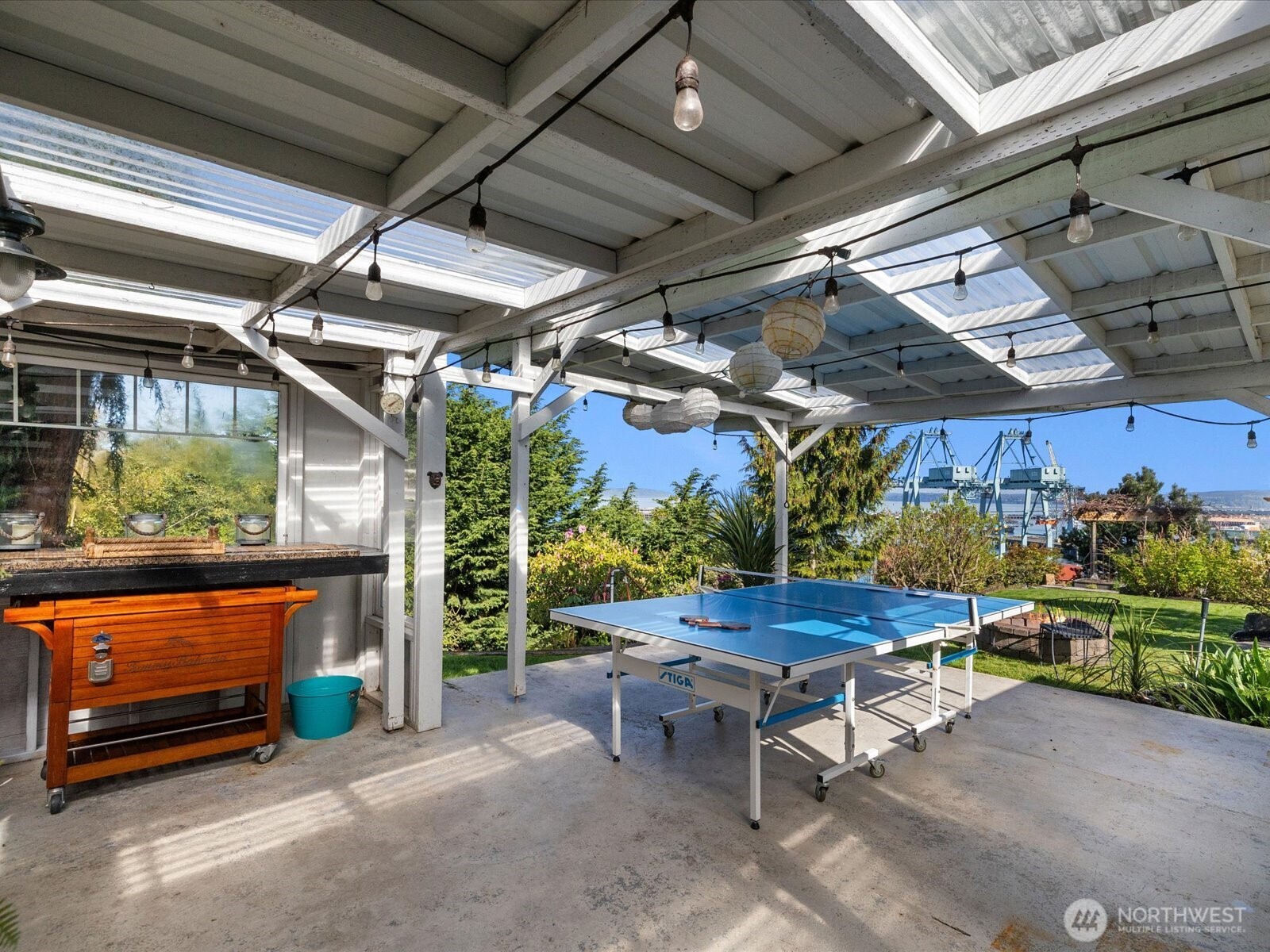 Backyard entertainment space + greenhouse