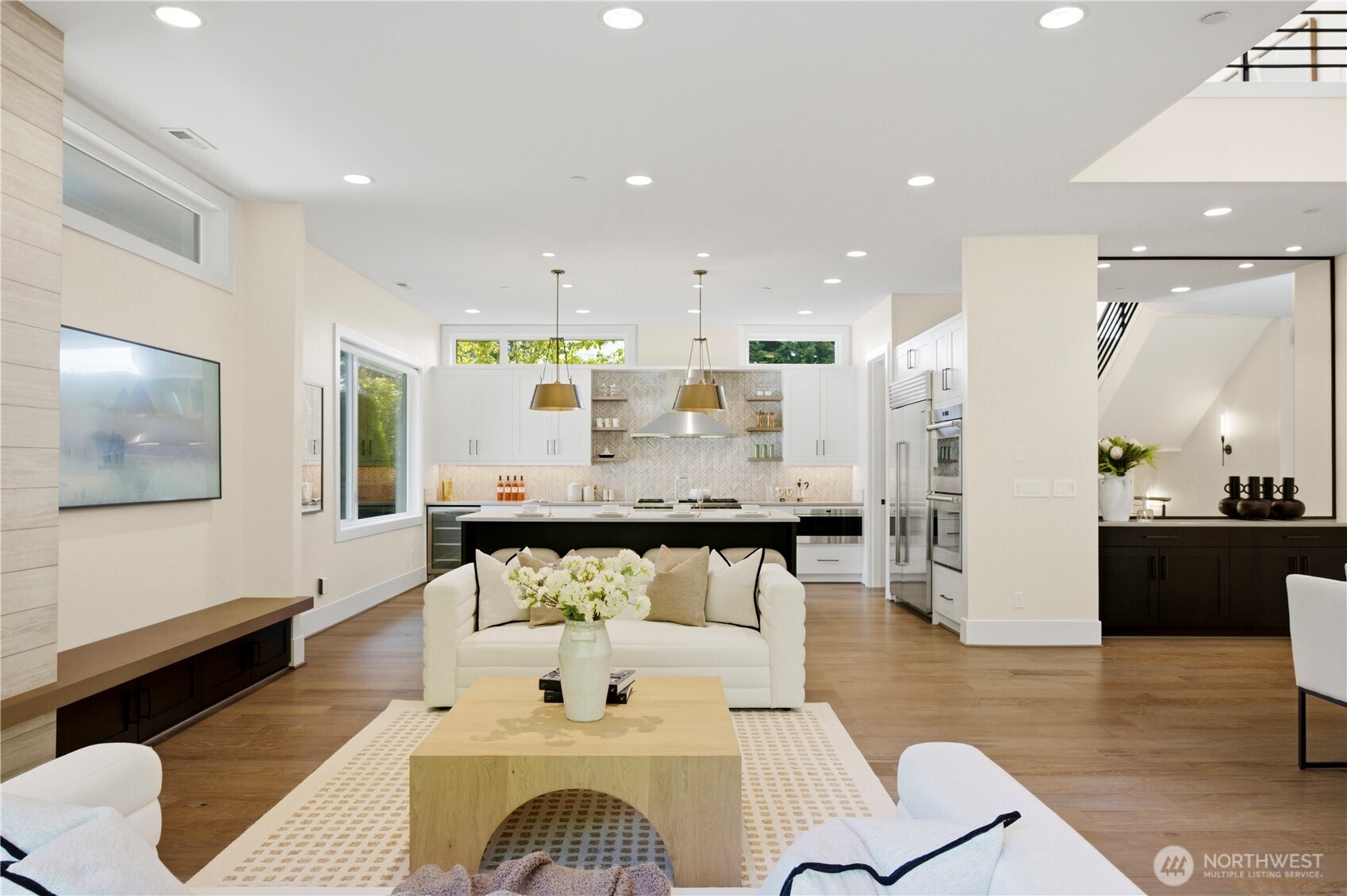 Seamless sightlines from the living room into the kitchen and dining area, enhancing the home’s open-concept flow.