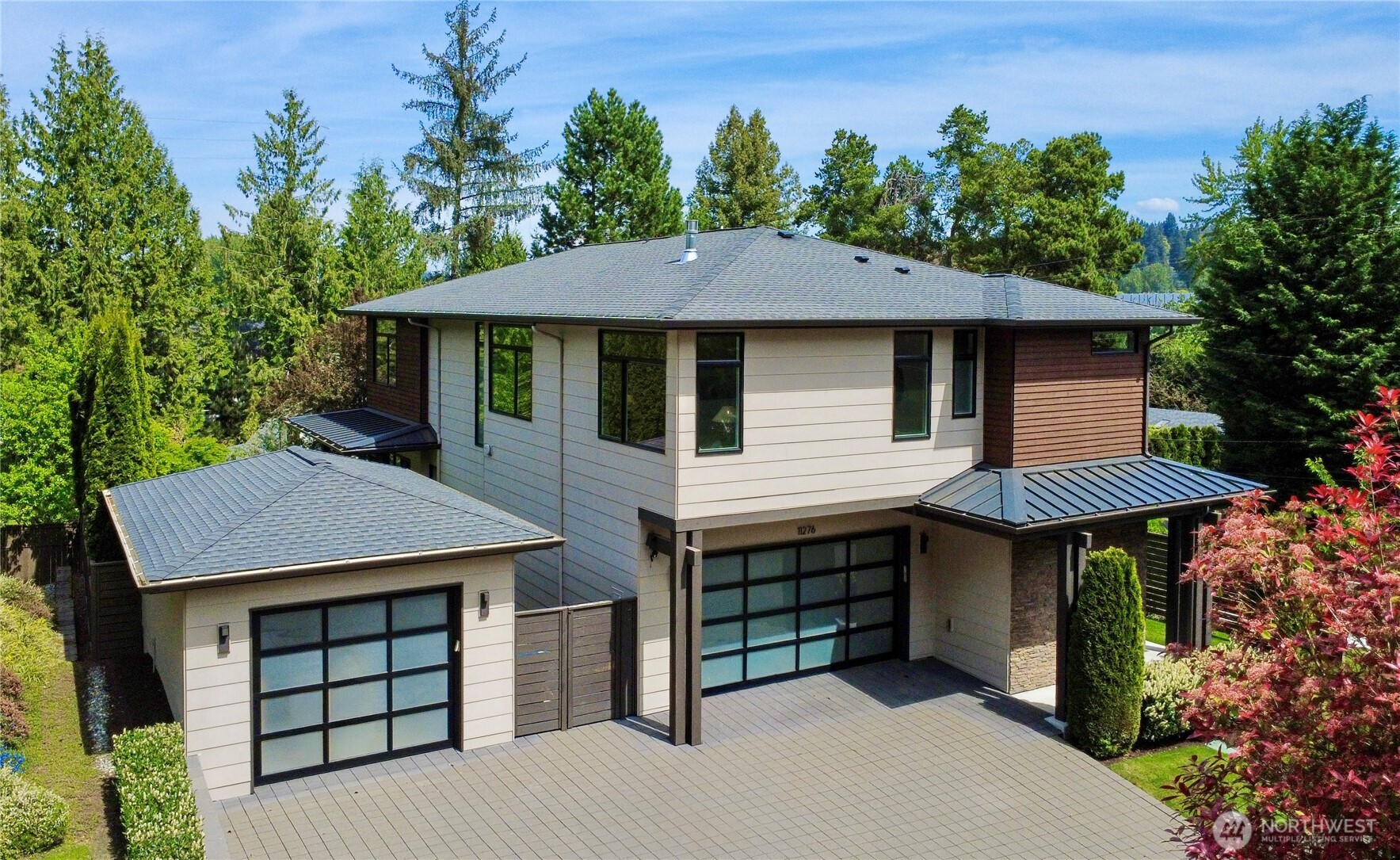 EV charger and rare three-car garage for modern convenience