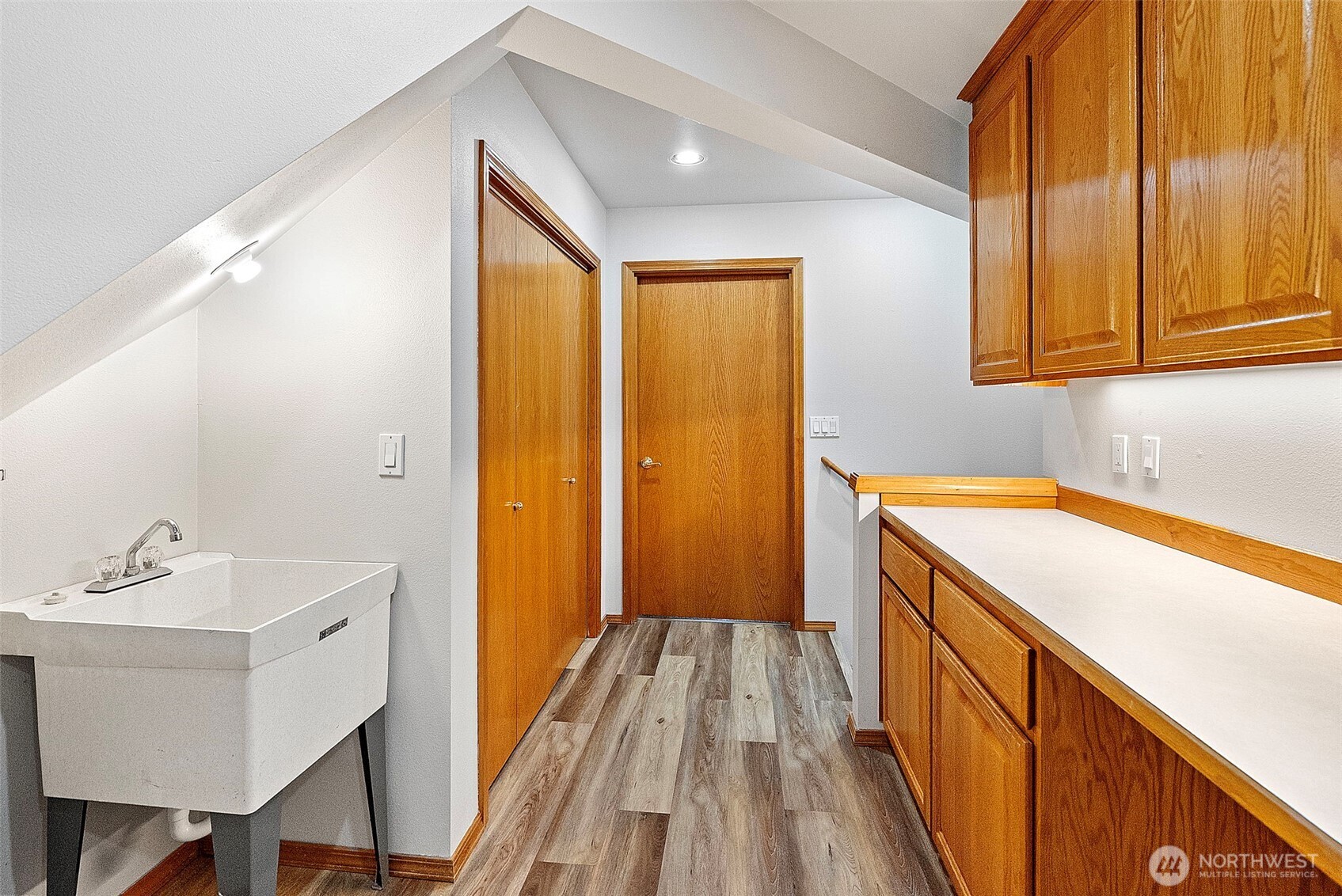 2nd floor utility room with sink and high end appliances
