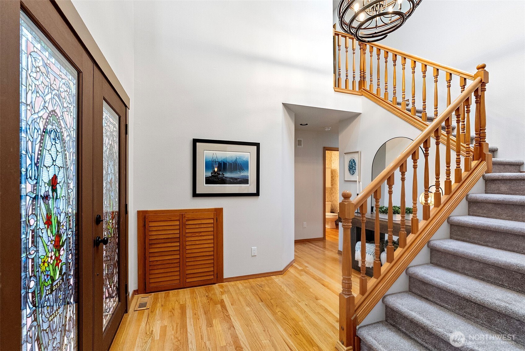 Vaulted entryway with staircase to 2nd floor