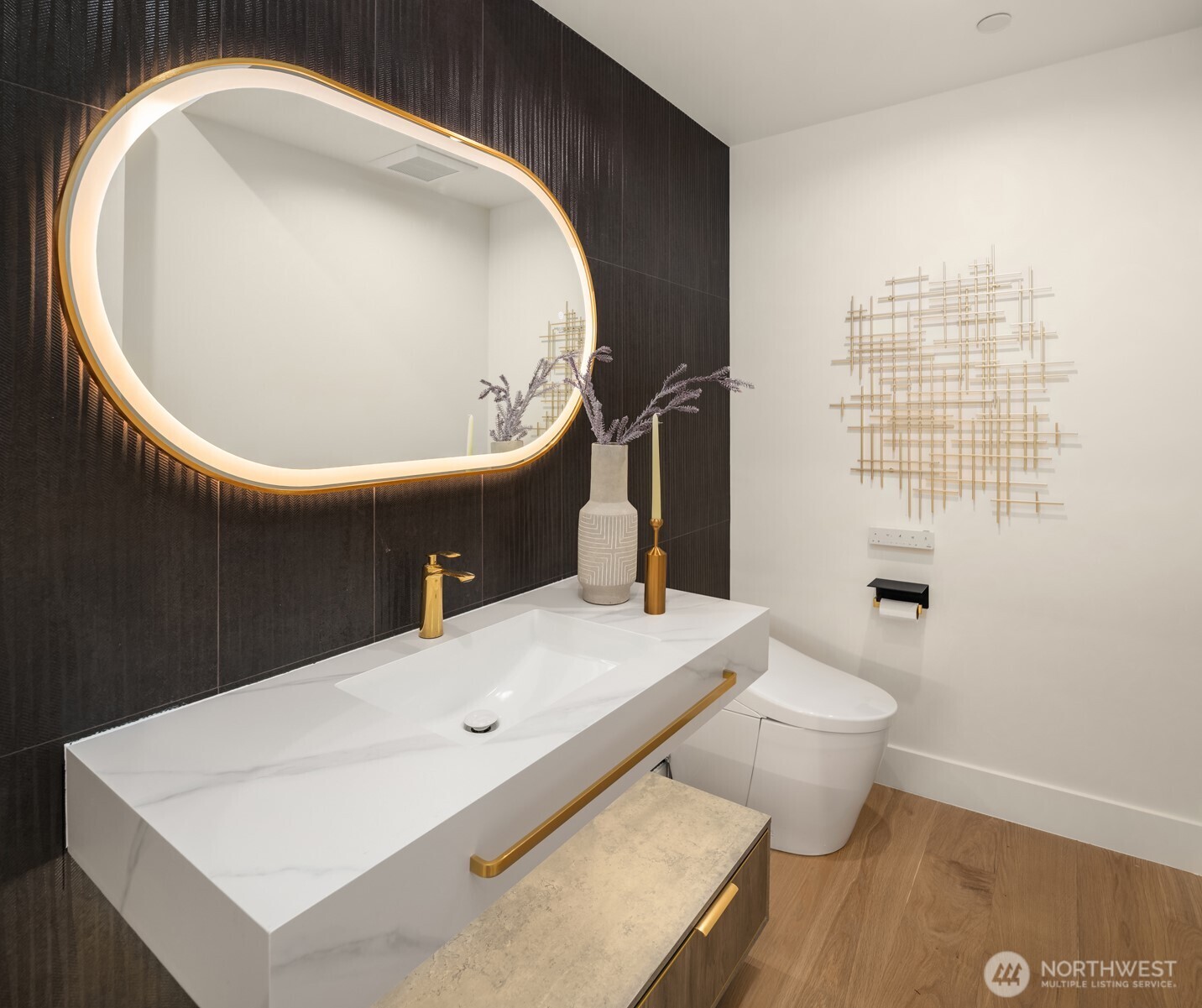A dramatic powder room with a TOTO smart bidet elevates the experience for every guest.