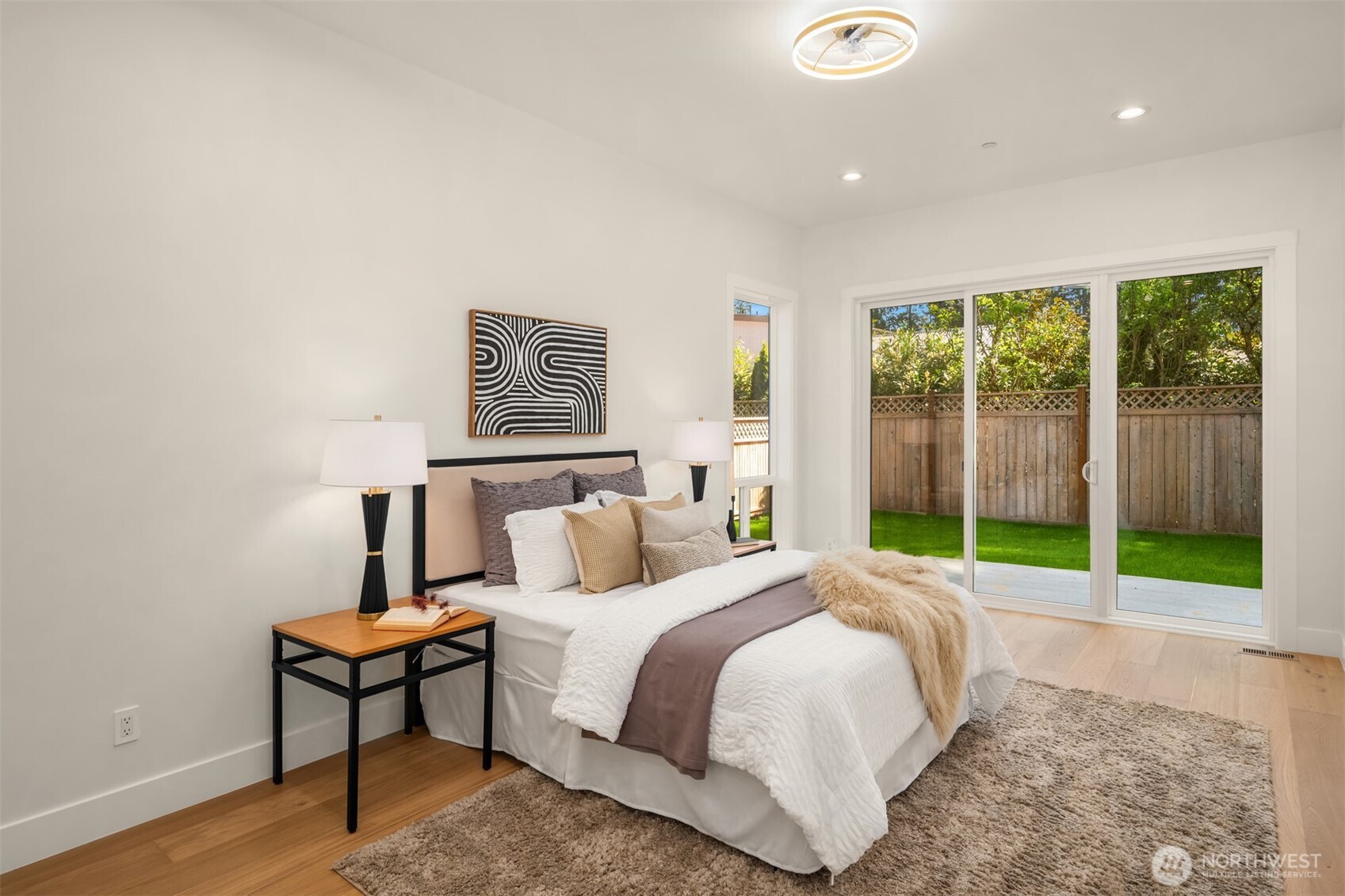 Extra spacious guest suite on Main with sliding door to peaceful backyard is perfect for guests!