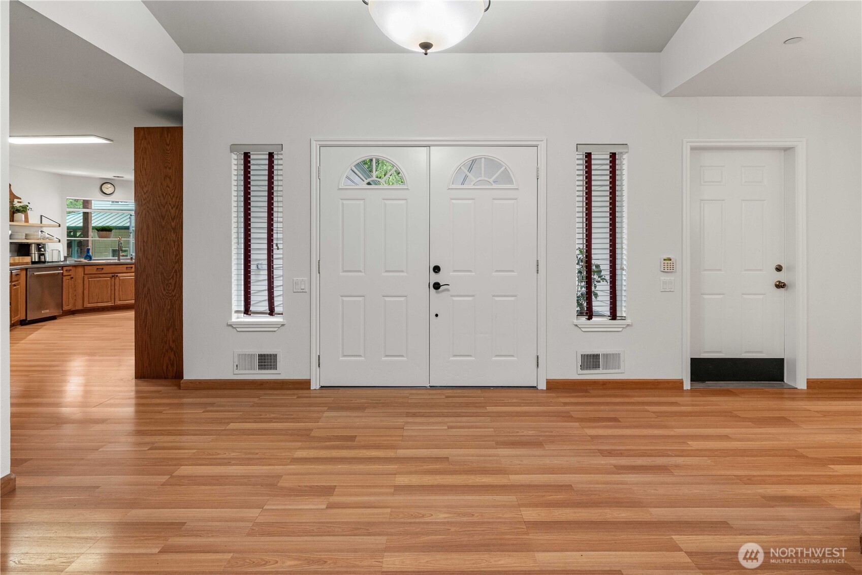 View from the dining room to the double front doors