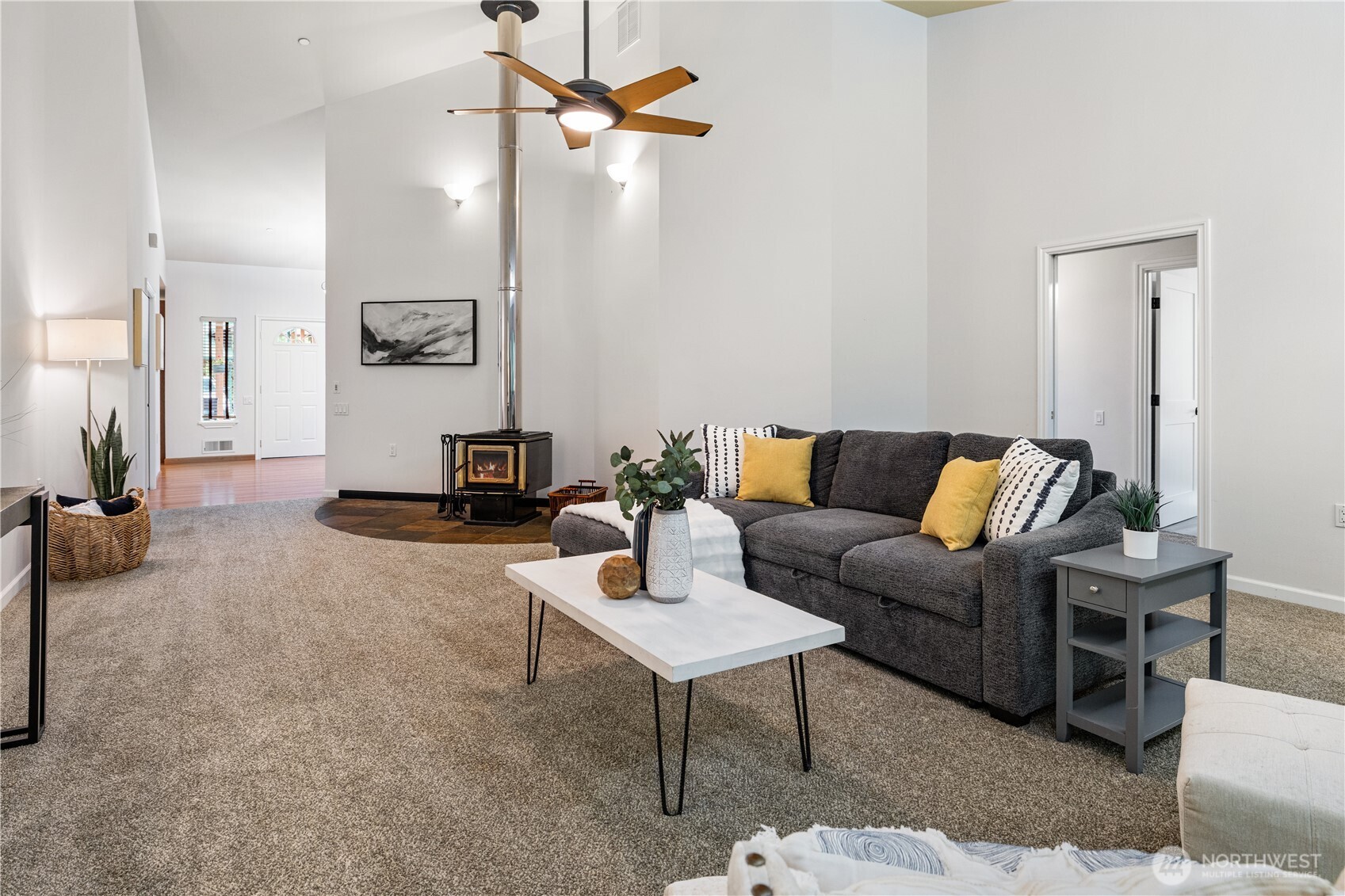 Living room woodstove and ceiling fan