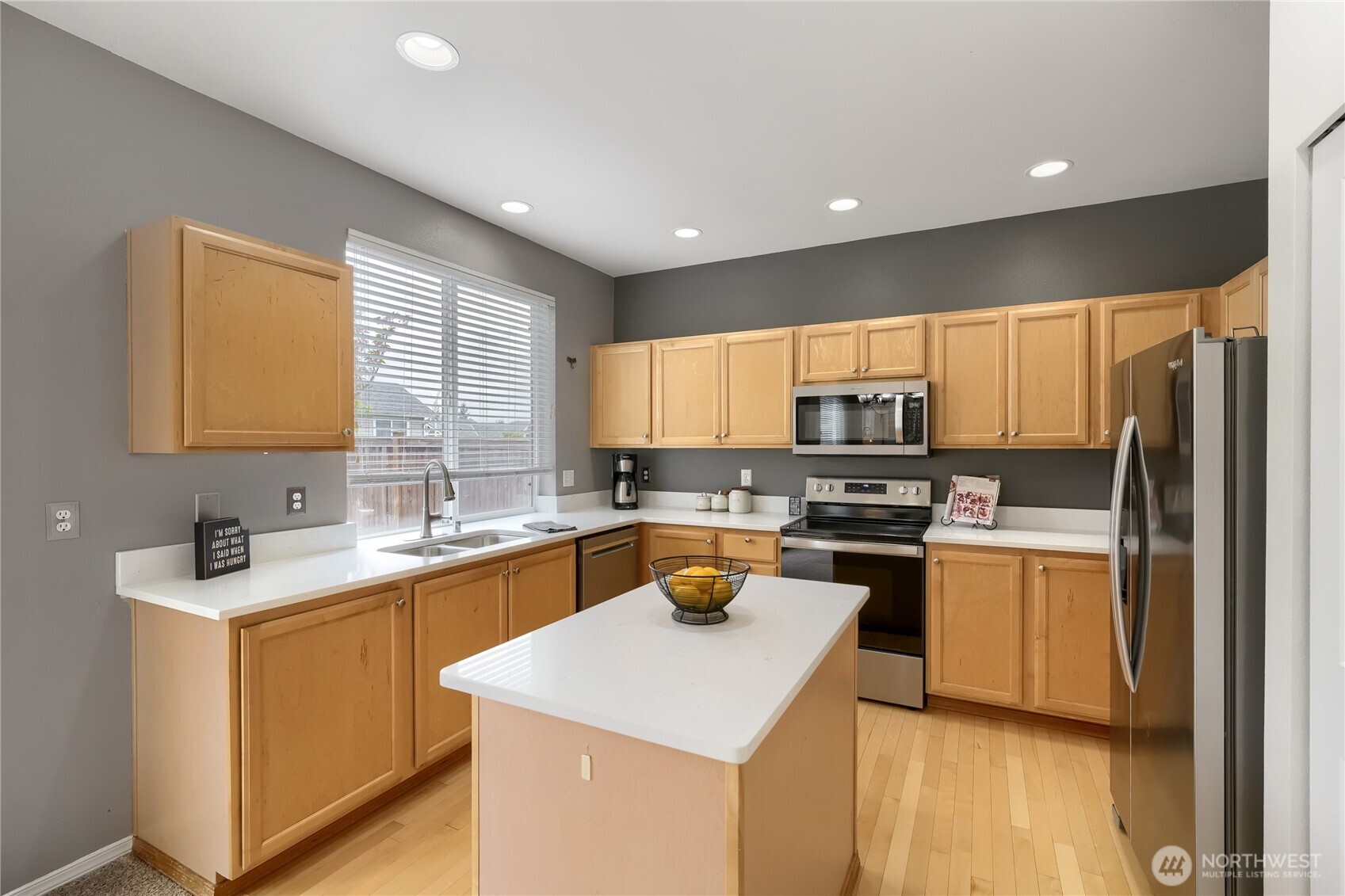 Updated kitchen with quartz countertops & stainless steel appliances
