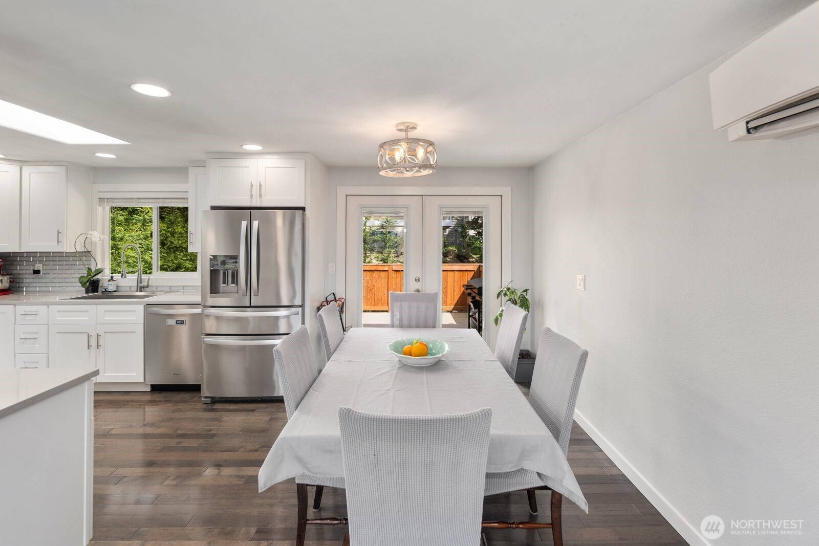 Private outdoor deck ideal for summer evenings, morning coffee, grilling, and entertaining under the trees