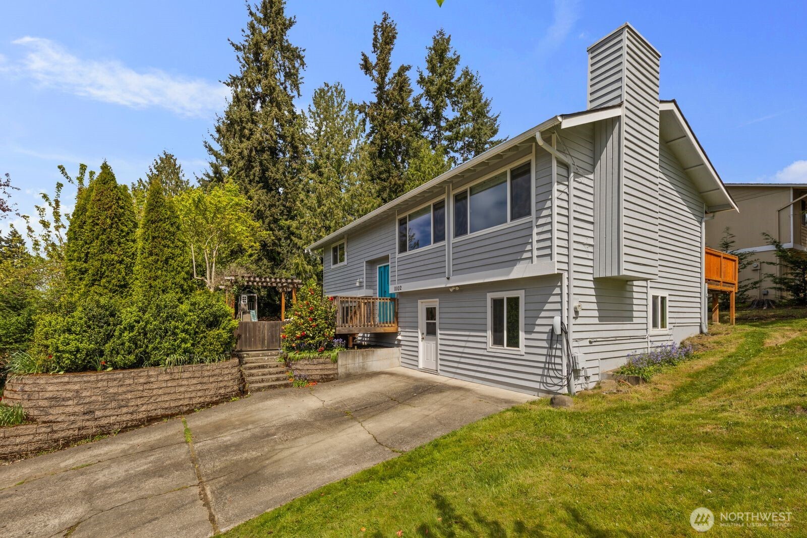 Beautifully renovated kitchen with quartz countertops, stainless appliances, and an open layout designed for connection and entertaining