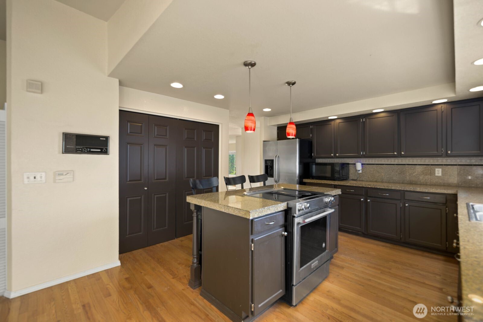 Kitchen with dual-basin sink set under a window, offering natural light over the main workspace