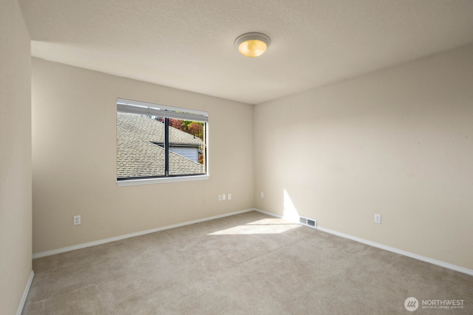 Additional bedroom with natural light and functional layout.