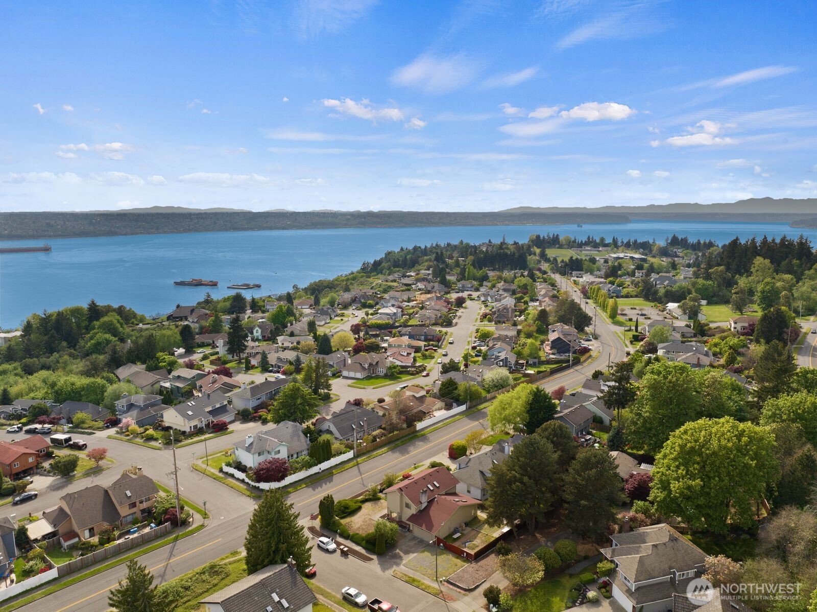 Positioned to show the surrounding neighborhood and proximity to the water, giving context to the location and lifestyle this area offers.