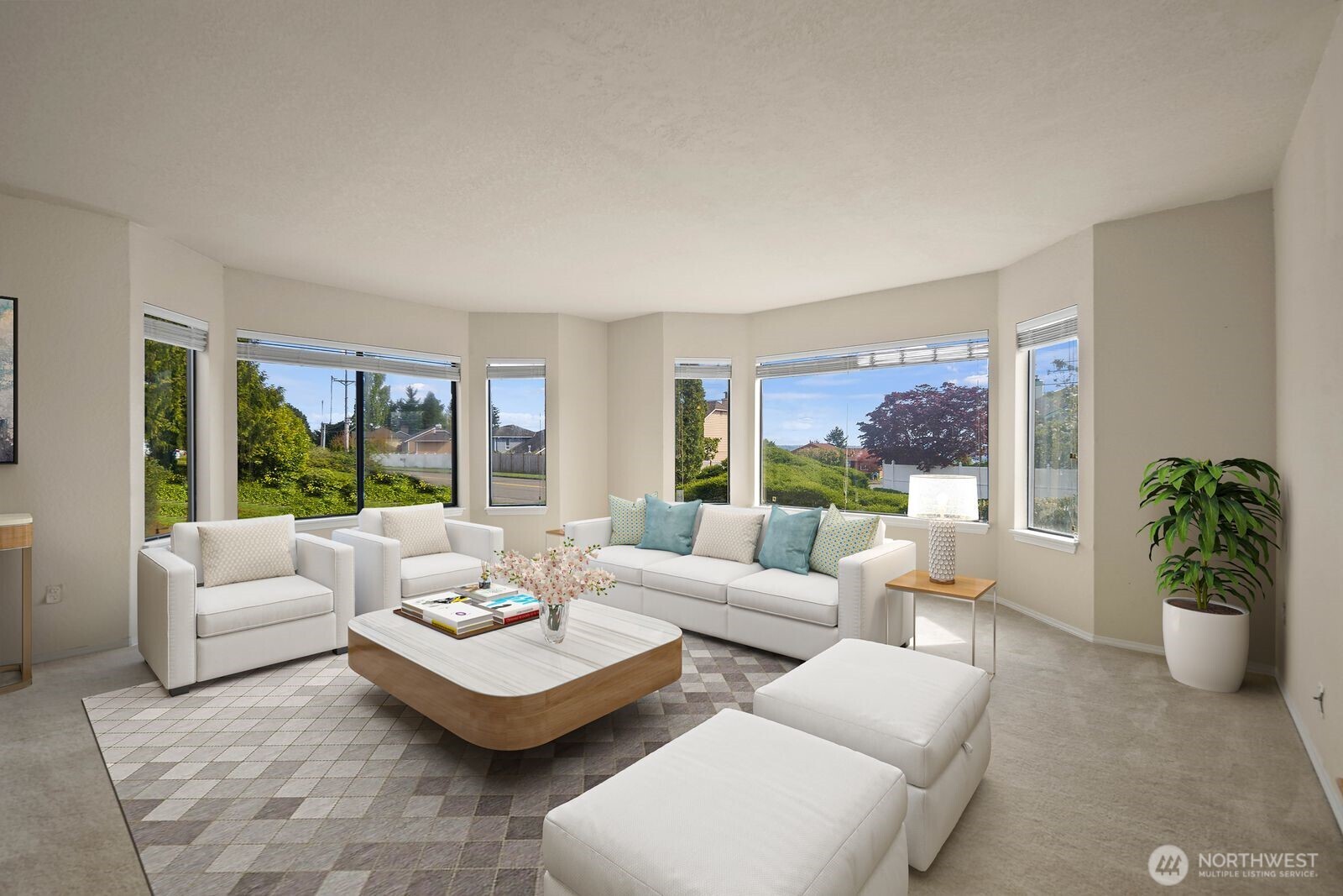 Staged to showcase the natural light and scale of the room, helping buyers visualize how the space can feel both open and inviting.