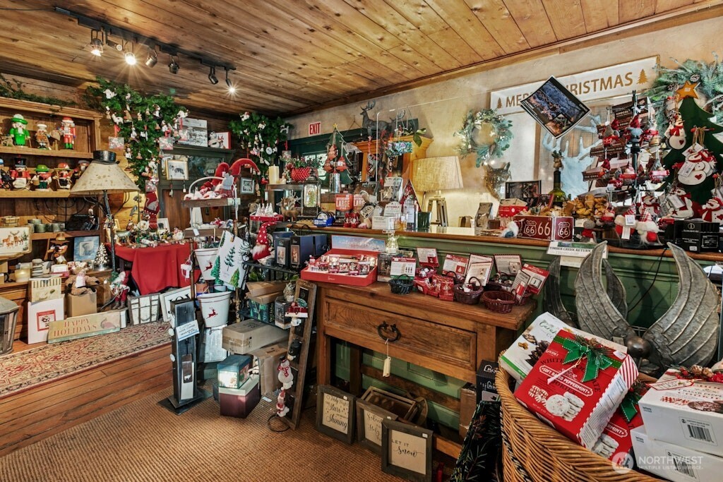 Main entry of The Christmas Shop at Timber Creek business, check out area.  This use to be the Carriage House many many years ago! Original wood flooring.