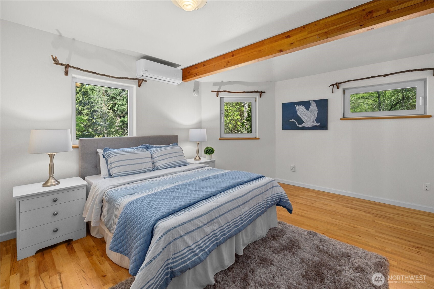 Large main-floor bedroom with plenty of light.
