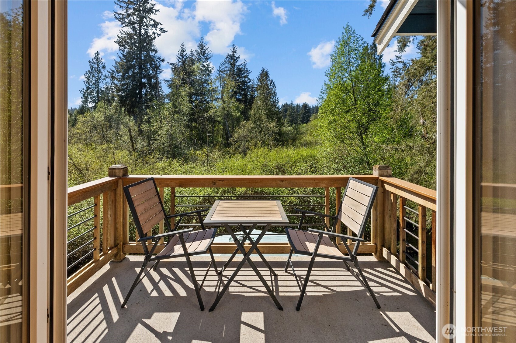 Enjoy the scenery from the primary bedroom's own deck.