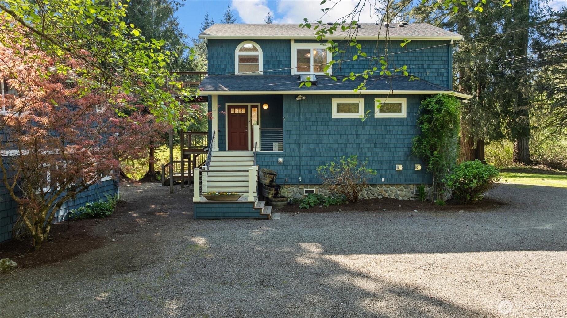 Covered front porch welcomes you.  The main house had a new roof installed in 2024.