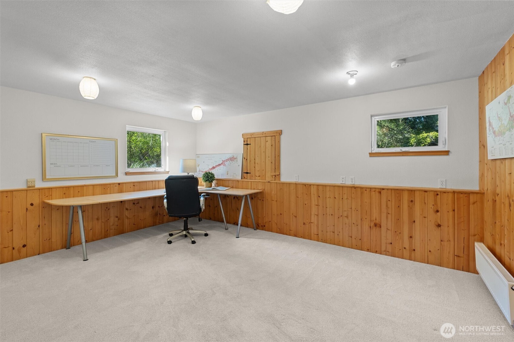 This large office or multi-purpose room located off the bonus room downstairs.