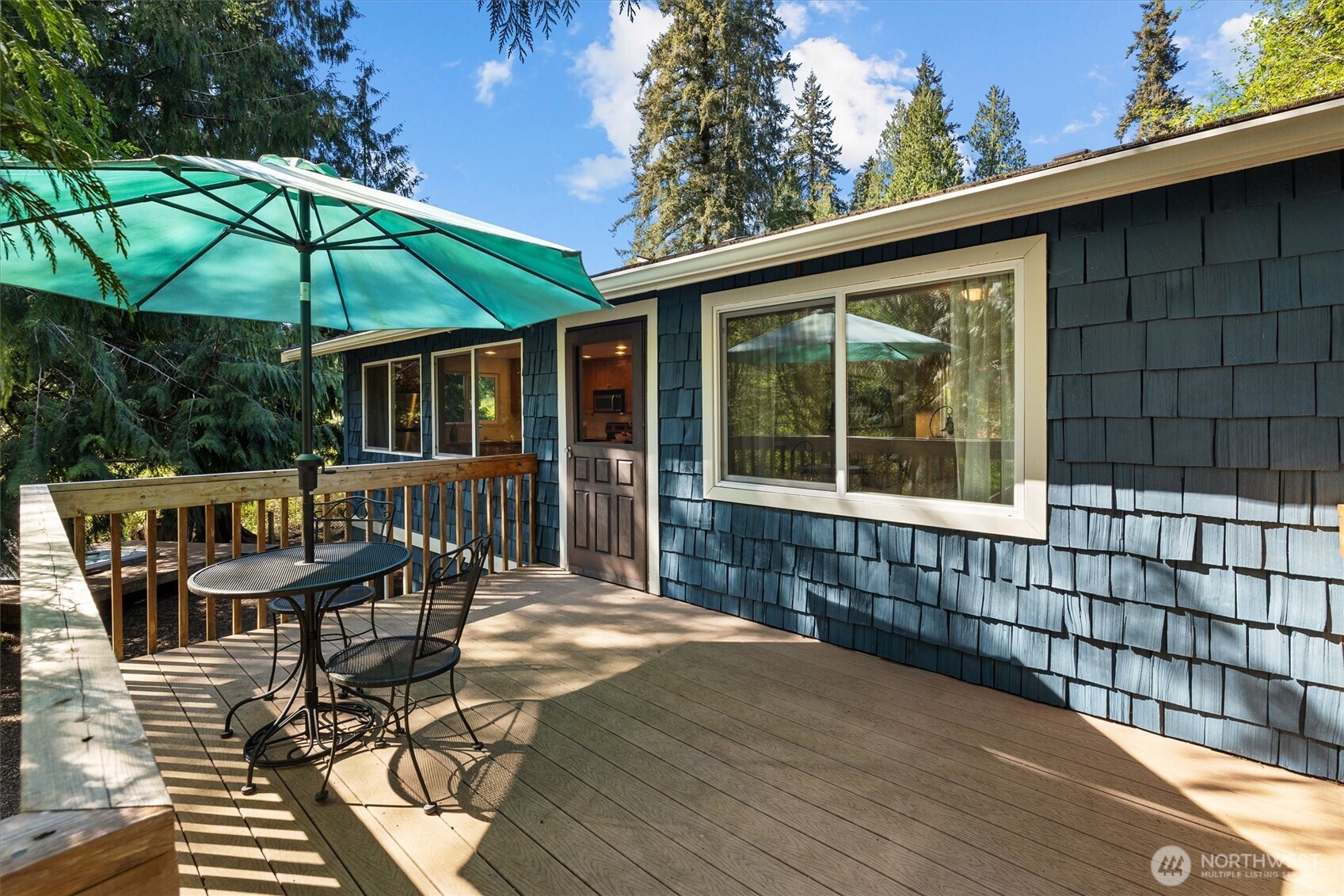 Enjoy the private deck off the kitchen of the ADU.