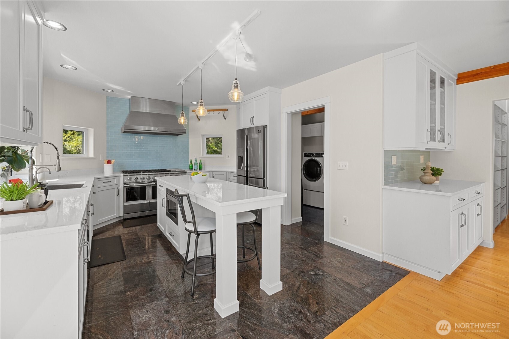 This angle shows the door leading to the walk-in pantry and laundry room.