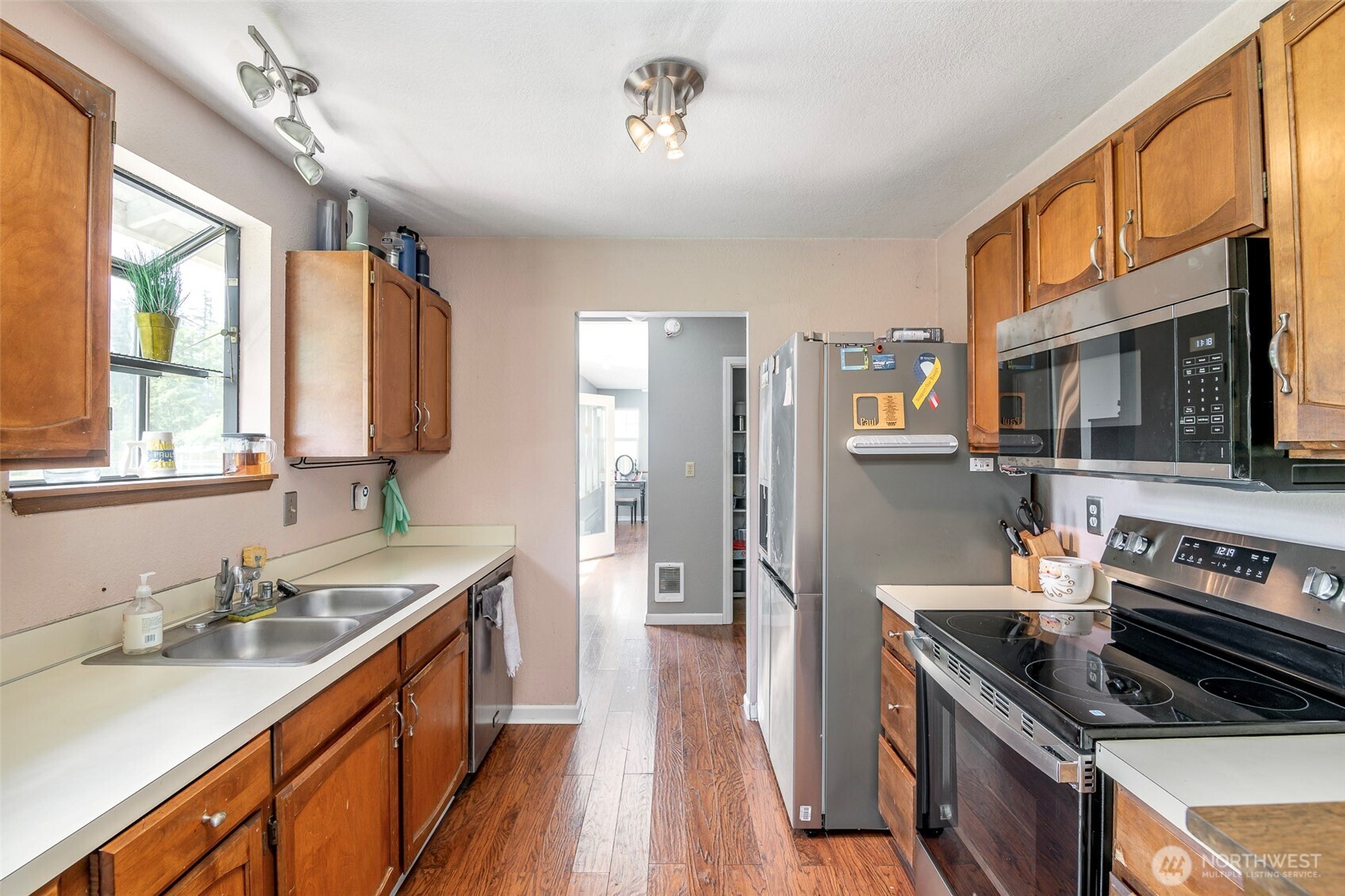 Kitchen with new stove, microwave and newer frig