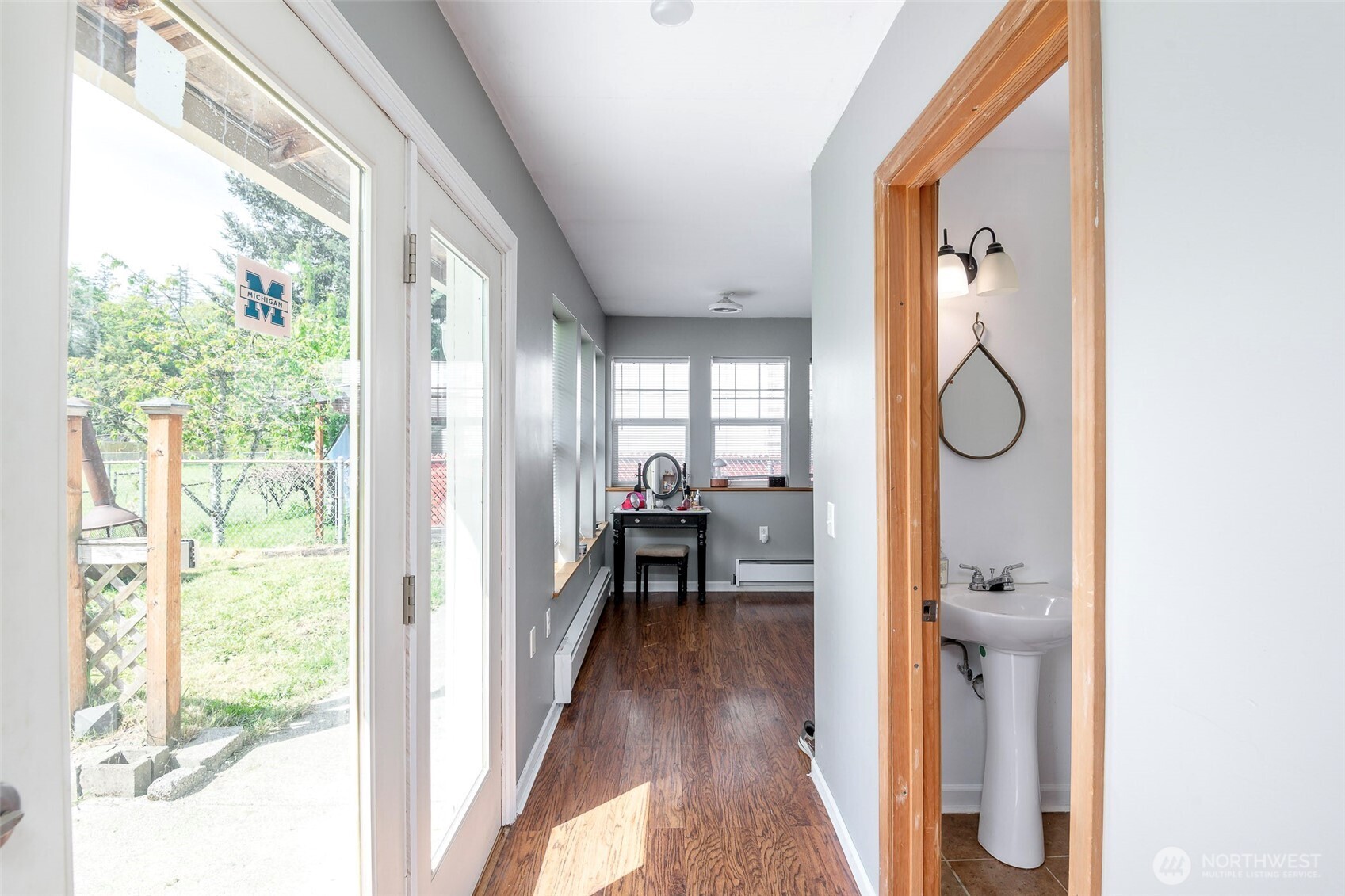 Hall way to bonus room, French doors on the left out to the backyard