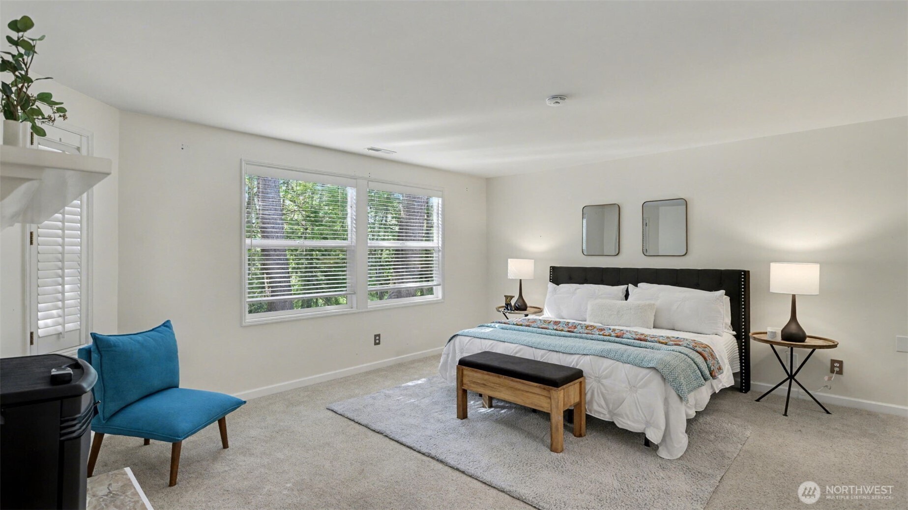 Space for a large bed and seating area in the primary bedroom.