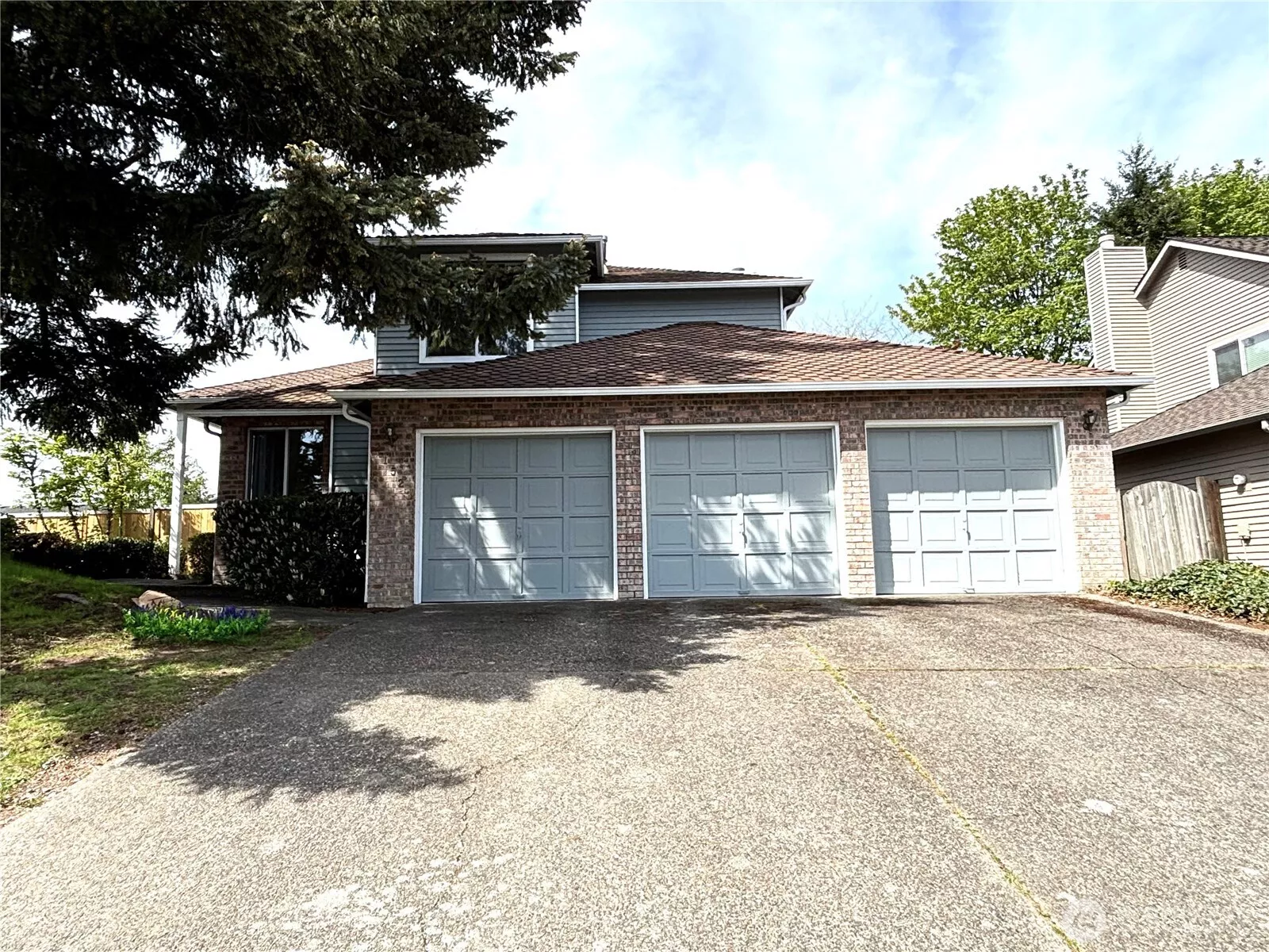 3 car garage and long driveway