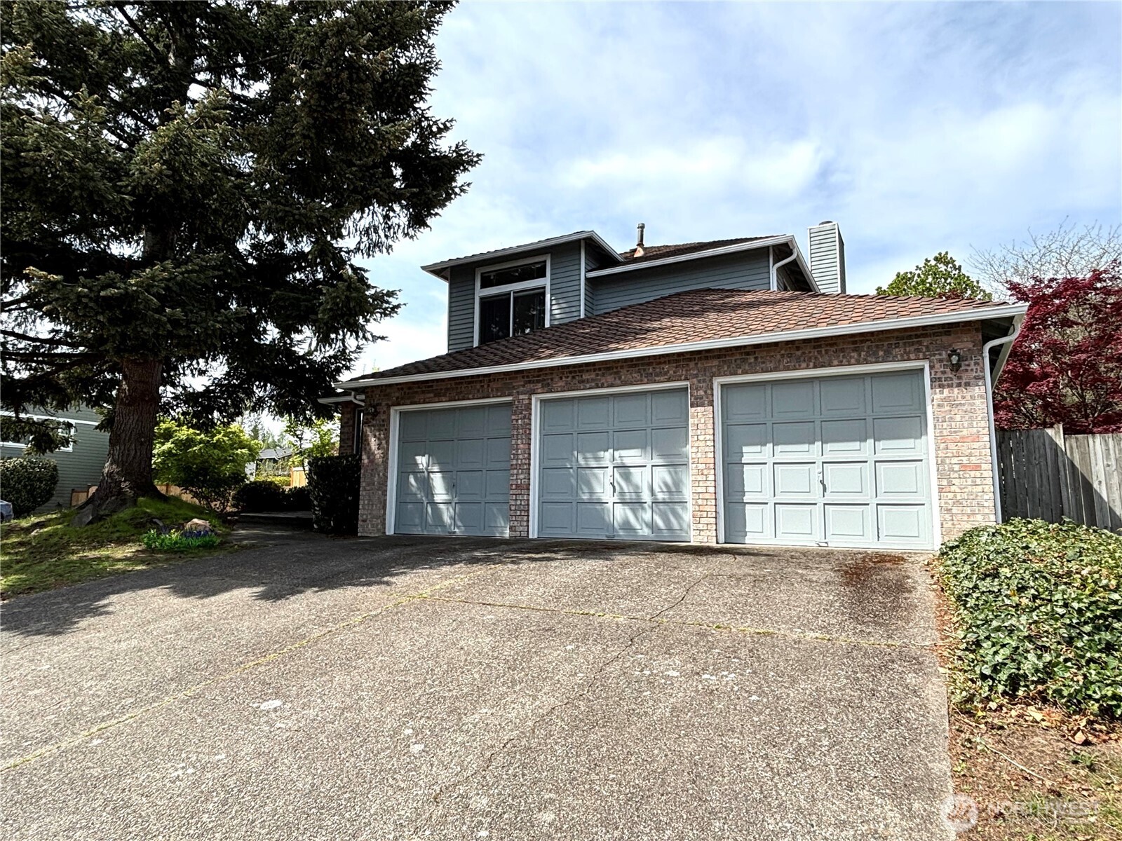 3 car garage and long driveway