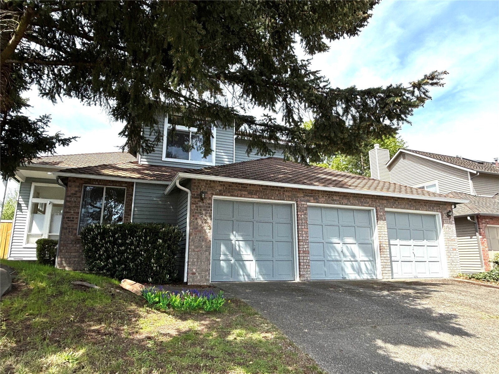 3 car garage and long driveway