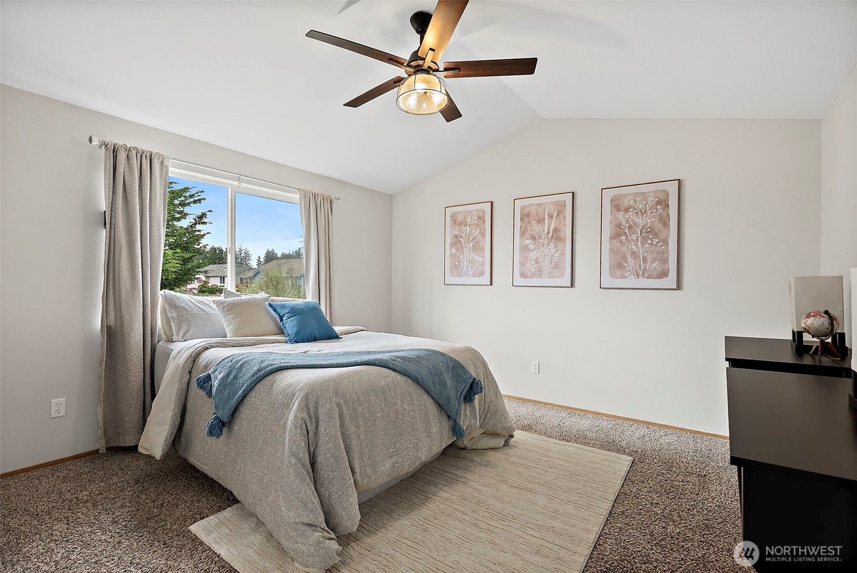 Large primary suite with vaulted ceiling.