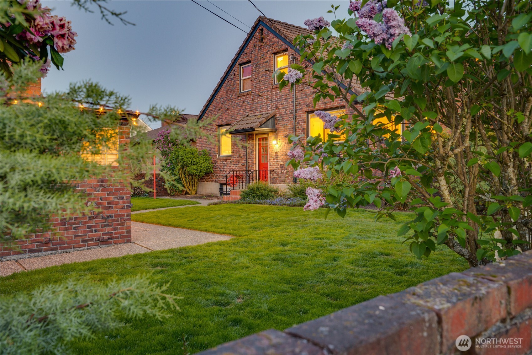 Gorgeous mostly-native landscaping with accent lighting and smart sprinklers